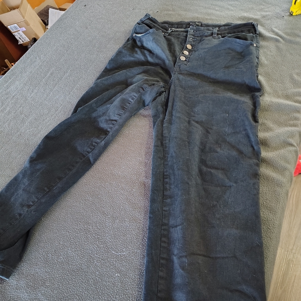 Black button fly universal standard jeans
